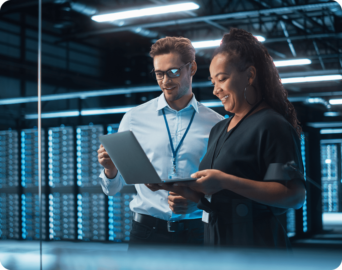 Colleagues discussing technology in a server room