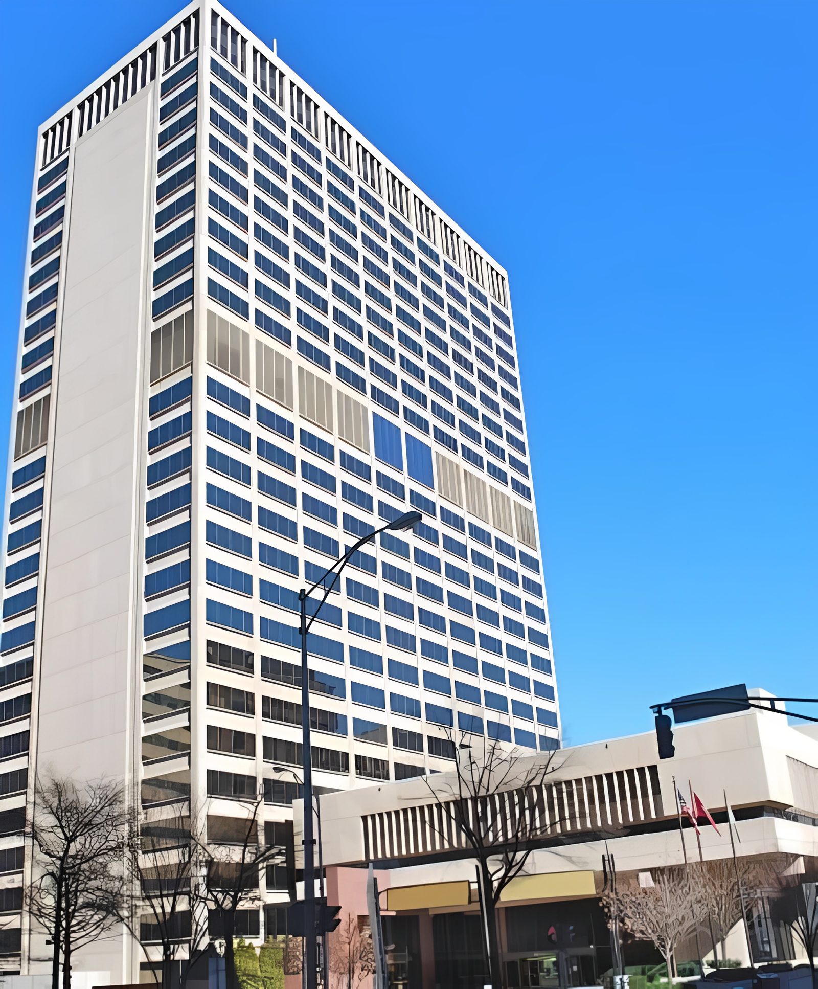 Tall office building under clear blue sky
