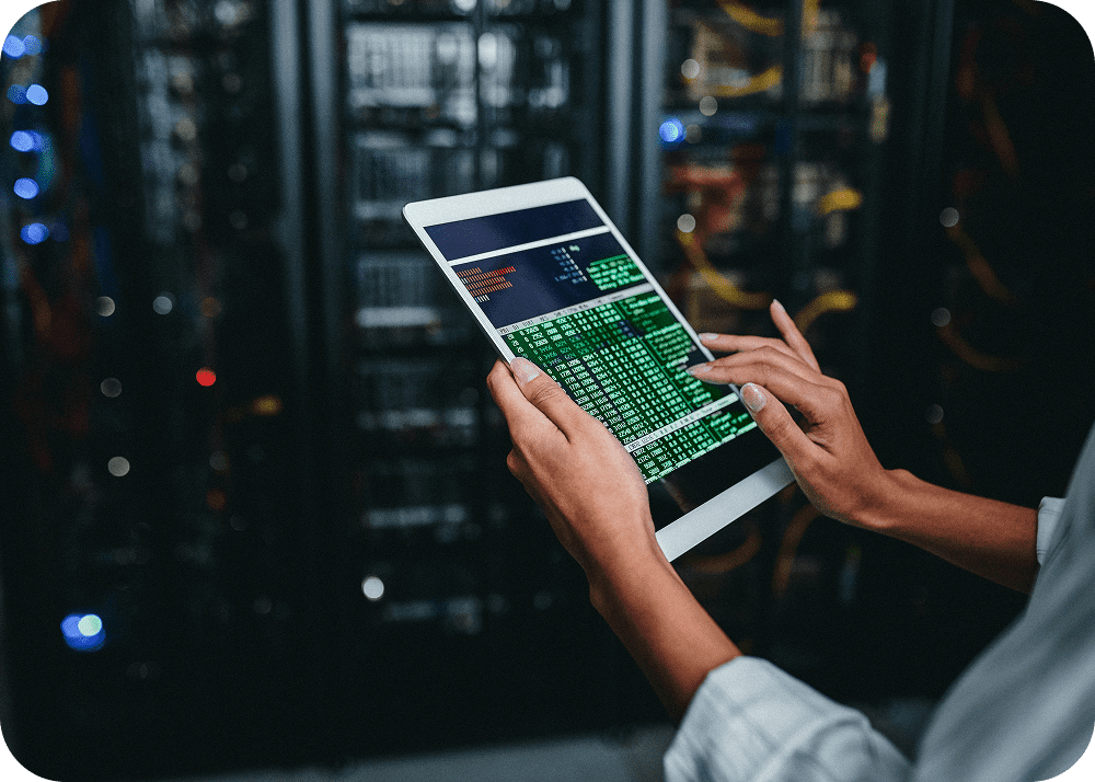 Tablet displaying code near servers
